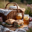 Outdoor Picnic with Fresh Baked Bread and Honey Jars in Sunlight