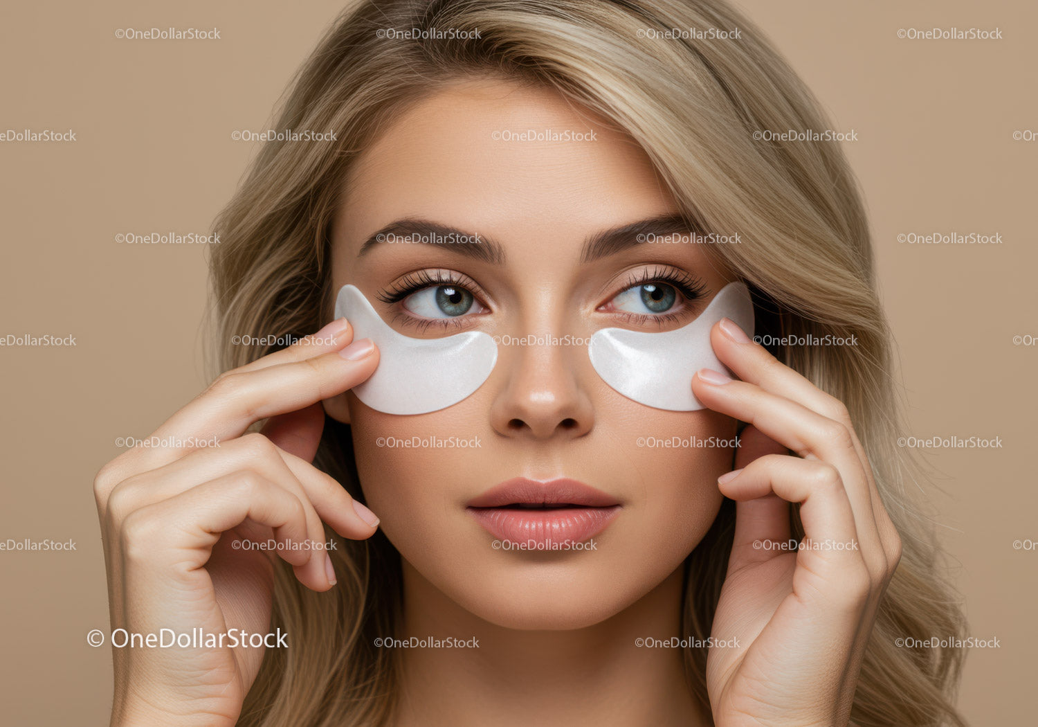 Young Woman Applying Under-Eye Patches For Skin Rejuvenation