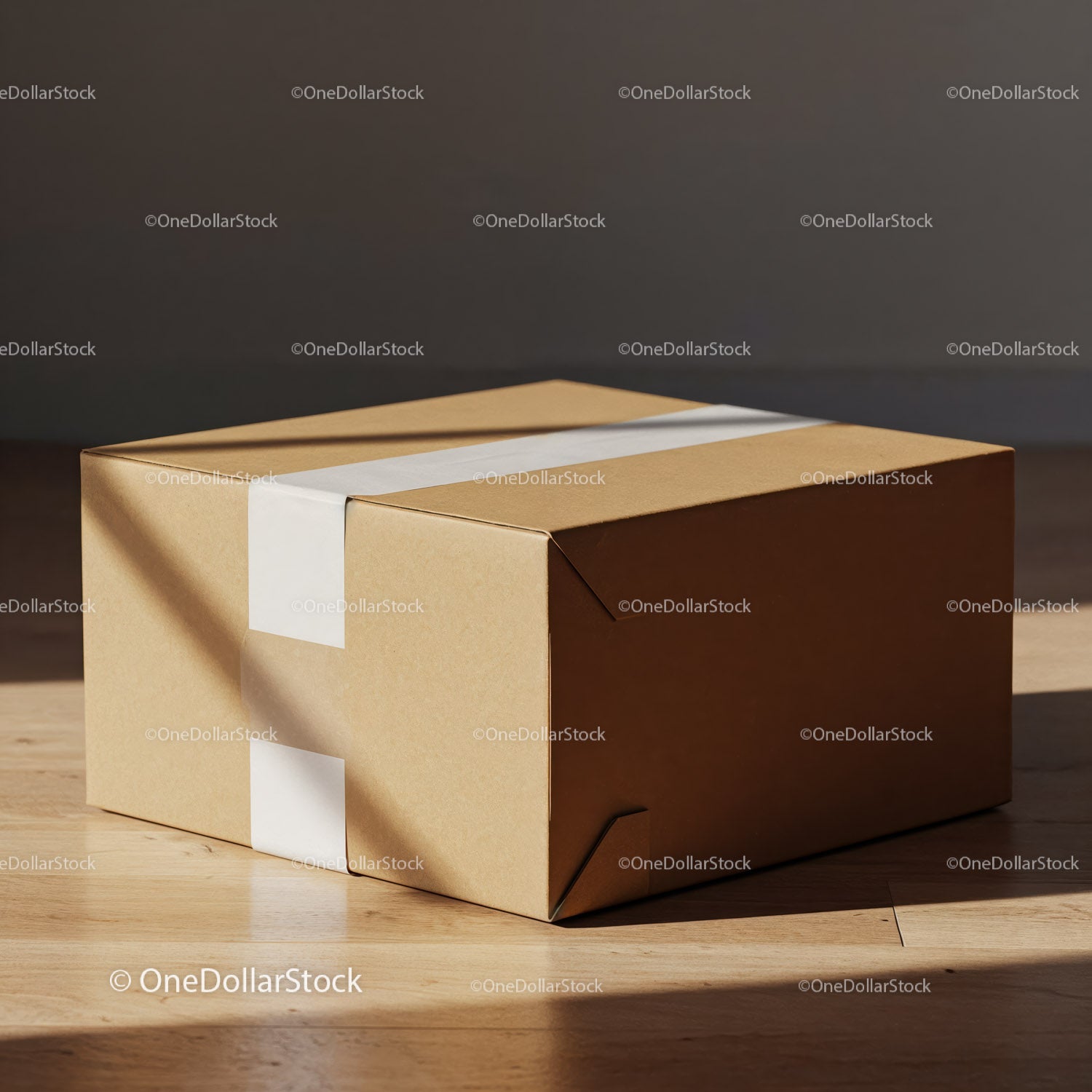 Closed cardboard delivery box on wooden floor with tape