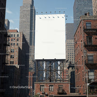 Empty billboard towering over urban brick buildings