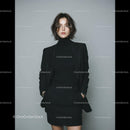 Elegant Business Woman in Black Suit Standing Confidently