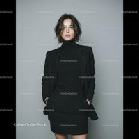 Elegant Business Woman in Black Suit Standing Confidently