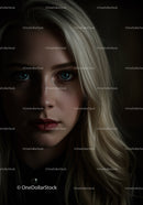 Portrait of contemplative blonde woman in low light