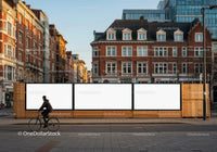 Urban street with blank billboard signs and cyclist