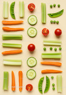 Fresh sliced vegetables arranged on beige surface