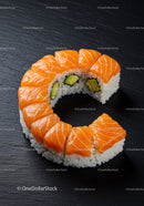Fresh salmon avocado sushi roll on black slate plate