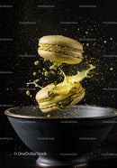Green Pistachio Macarons with Cream Splash in Dark Bowl