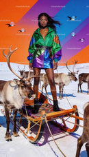 Confident woman in vibrant outfit riding reindeer sled