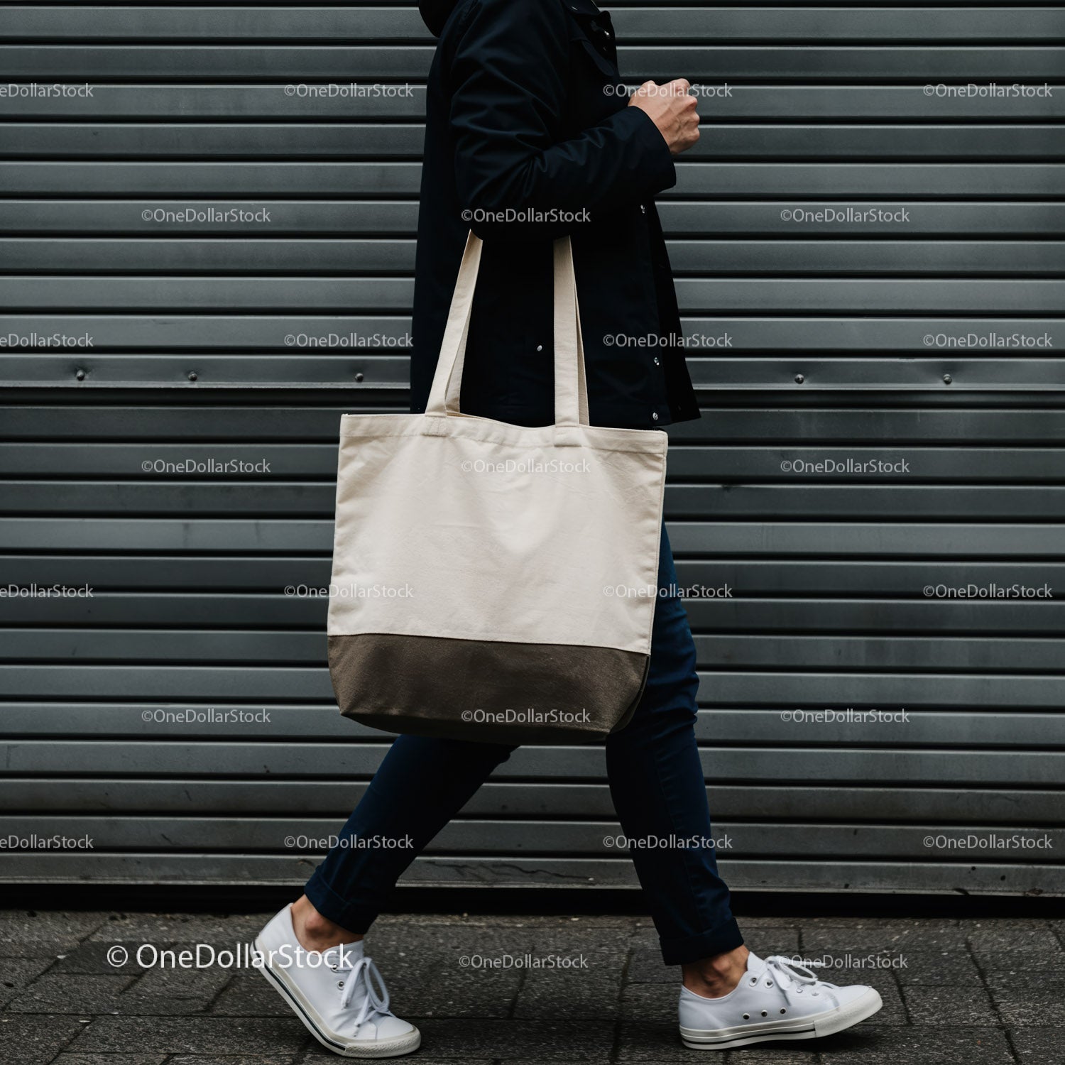 Person Walking with Neutral Canvas Tote Bag by Wall