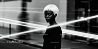Portrait of elegant woman with platinum hair in urban night
