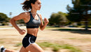 Fit young woman running outdoors in activewear