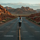 Runner on Remote Road Surrounded by Rocky Desert Landscape