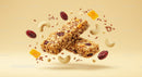 Two Granola Bars with Nuts and Dried Fruits Floating