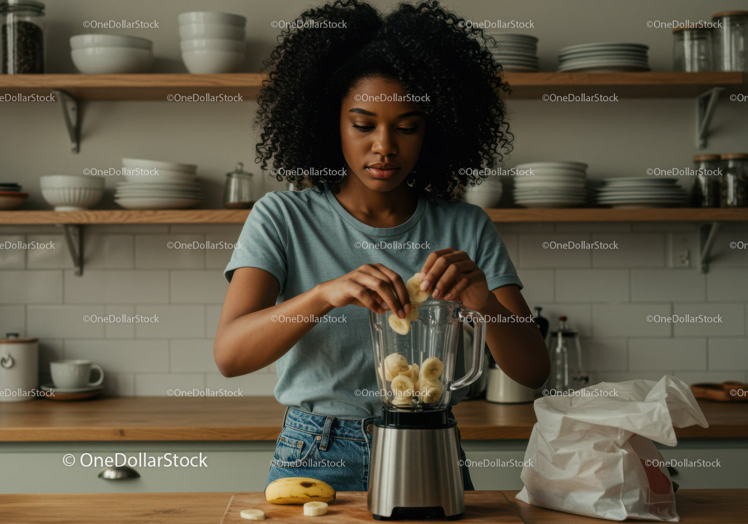 Young woman preparing healthy banana smoothie in modern kitchen