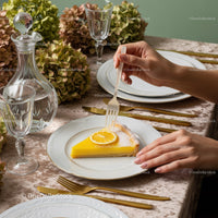 Elegant Lemon Cake with Floral Centerpiece and Gold Cutlery