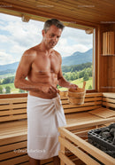 Middle-aged Man Enjoying Sauna in Wooden Wellness Retreat with Mountain View