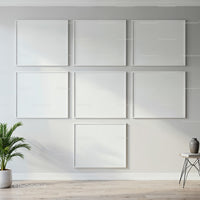 Minimalist empty white frames arranged on modern wall