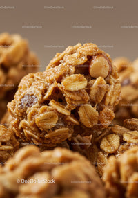 Closeup of crunchy granola clusters with nuts and oats