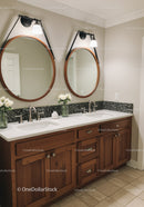Double Bathroom Vanities with Wooden Cabinets and Modern Lighting