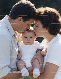 Parents Sharing Tender Moment with Their Baby Outdoors