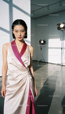 Elegant asian woman in silk dress posing in studio light