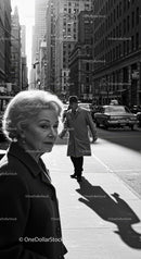 Elderly Woman in Busy City Street Surrounded by Vintage Cars