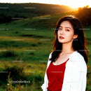 Young woman in red top enjoying sunset outdoors