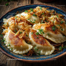 Japanese Gyoza Dumplings with Crispy Edges and Green Garnish