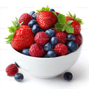 Fresh Mixed Berries in a White Bowl with Green Leaves
