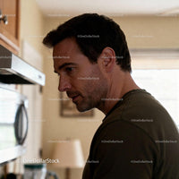 Thoughtful man preparing meal in cozy kitchen