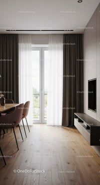 Modern dining area with large window and elegant curtains