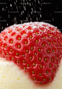 Close-up of Fresh Strawberry with Powdered Sugar on Cream