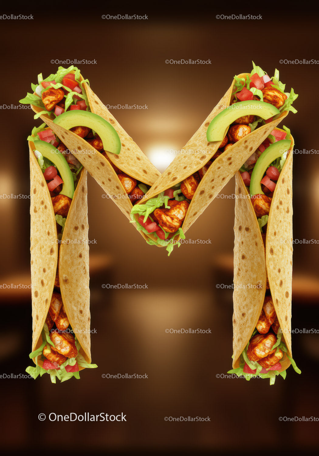 Letter M formed by fresh chicken tacos with avocado