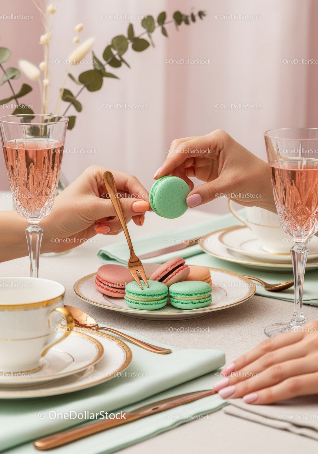 Elegant Pink and Green Macarons on a Stylish Tea Party Table
