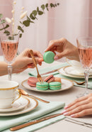 Elegant Pink and Green Macarons on a Stylish Tea Party Table