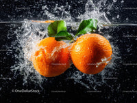 Fresh Orange Tangerines Splashing into Water with Green Leaves