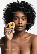 Elegant Black Woman with Curly Hair Holding Passion Fruit Portrait