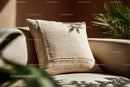 Beige Textured Cushion on Cozy Sofa with Sunlight Shadows
