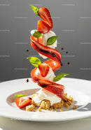 Fresh strawberries and cream dessert with basil leaves