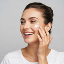 Woman Applying Facial Cream for Radiant Skin Beauty Skincare
