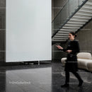Blurred woman walking in modern minimalistic lobby