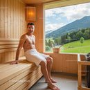 Men Relaxing in Wooden Sauna with Mountain and Green Landscape View
