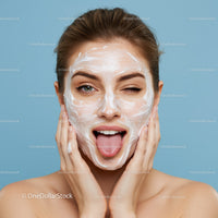 Young Woman Applying Facial Mask with Bright Healthy Skin
