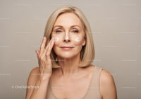 Mature Woman Applying Skincare Lotion with Confidence