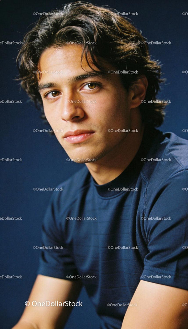Young man in athletic wear with thoughtful expression