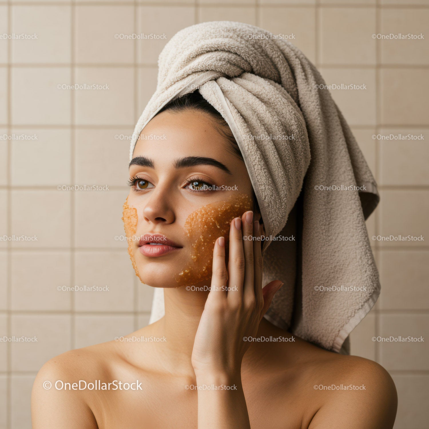 Young Woman with Towel on Head Applying Face Mask in Spa