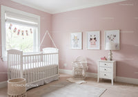 Cozy Nursery Room with Pink Walls and Animal Artwork for Children