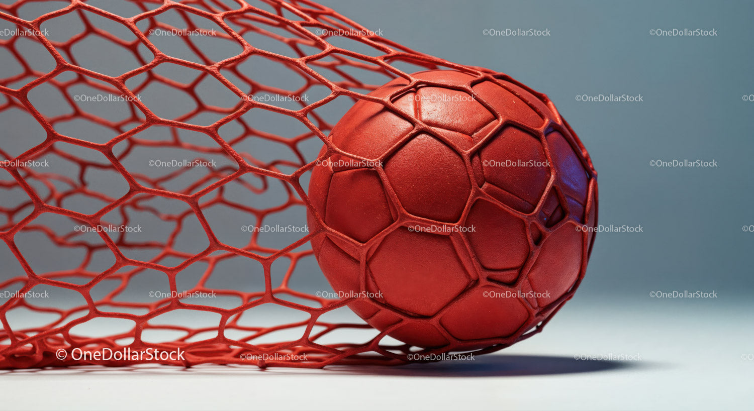 Red Soccer Ball Inside Net on a Sports Court