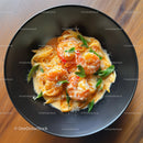 Seafood Pasta with Shrimp and Basil in a Black Bowl