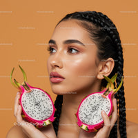 Beautiful Woman with Braided Hair Holding Fresh Dragon Fruit